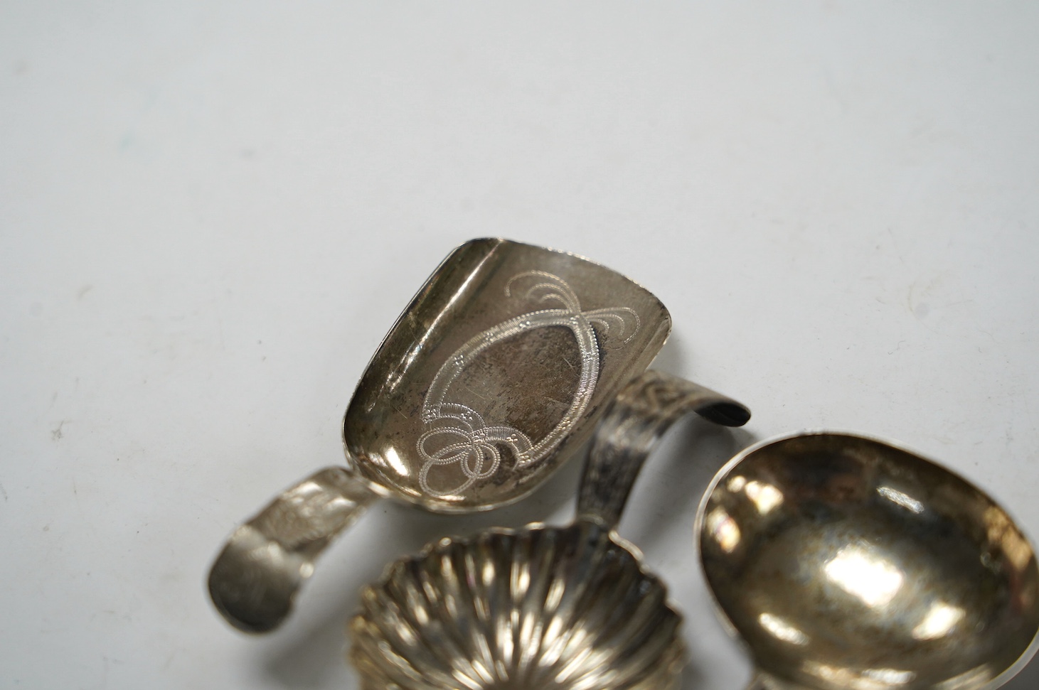 Five assorted silver caddy spoons, including shovel shape by Cocks & Bettridge, Birmingham, 1808, 71mm, oval bowl, John Blake, London, 1804, square bow, Joseph Wilmore, Birmingham, 1810, shell bowl, Joseph Taylor, Birmin